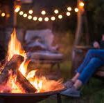 Outdoor fire pit with outdoor lighting